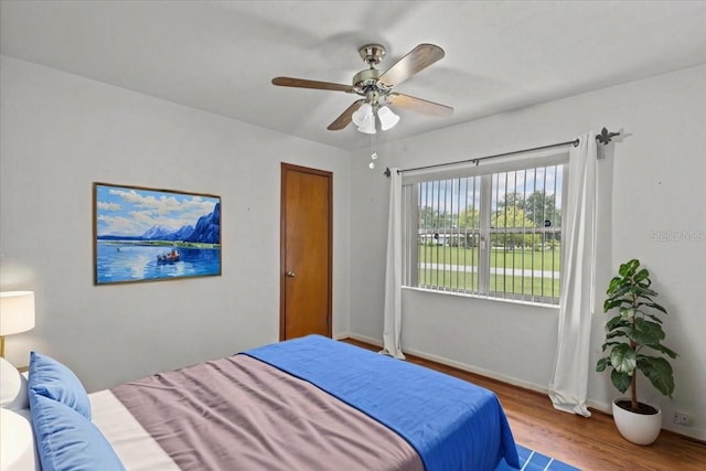 bedroom featuring ceiling fan and hardwood / wood-style flooring