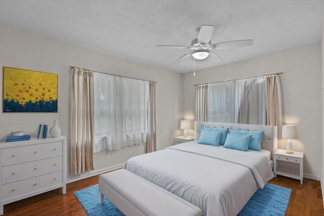 bedroom featuring dark hardwood / wood-style flooring and ceiling fan