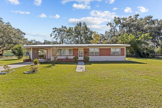 single story home with a carport and a front yard