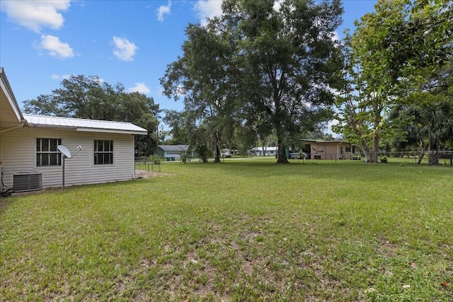 view of yard with central AC