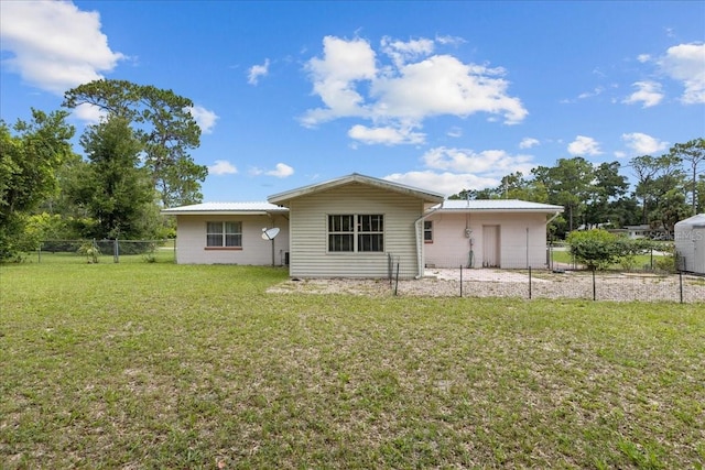 back of house with a yard