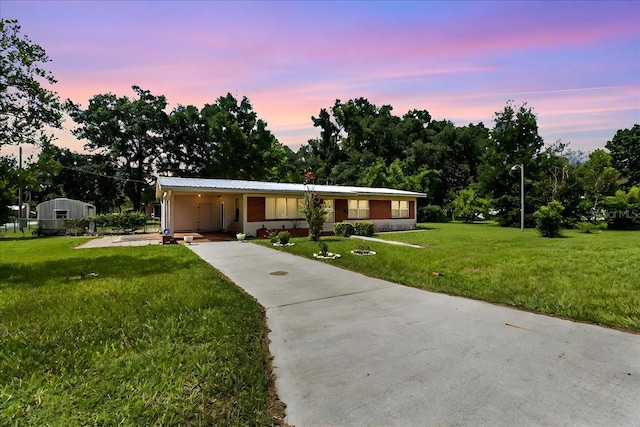 ranch-style house with a yard