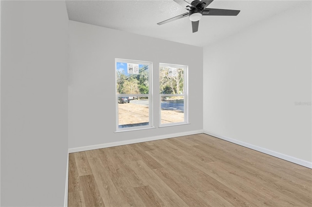 spare room featuring ceiling fan and light wood-type flooring