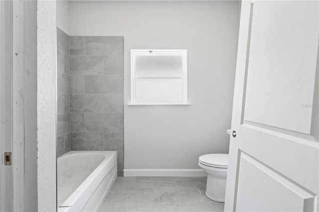 bathroom with tile patterned floors, toilet, and shower / tub combination