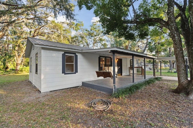 single story home featuring a patio