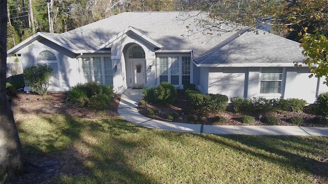 ranch-style house featuring a front yard