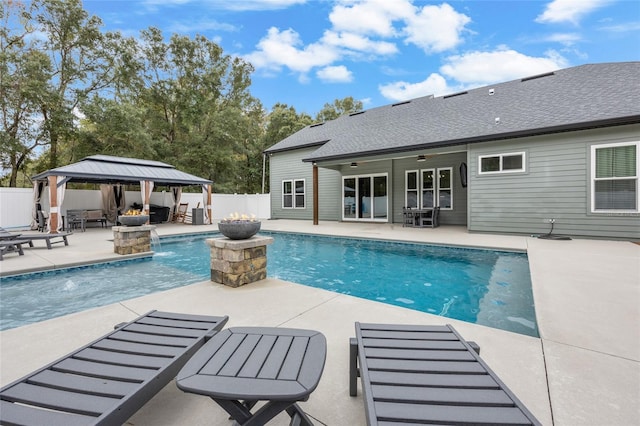 view of pool featuring a gazebo, ceiling fan, a patio, and pool water feature