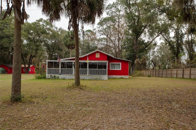 exterior space featuring a sunroom