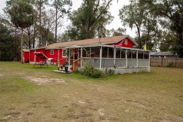 back of property with a yard