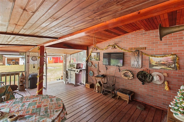 wooden deck featuring area for grilling