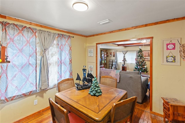 dining area with wood-type flooring