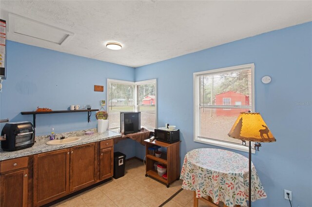 office with sink and a textured ceiling