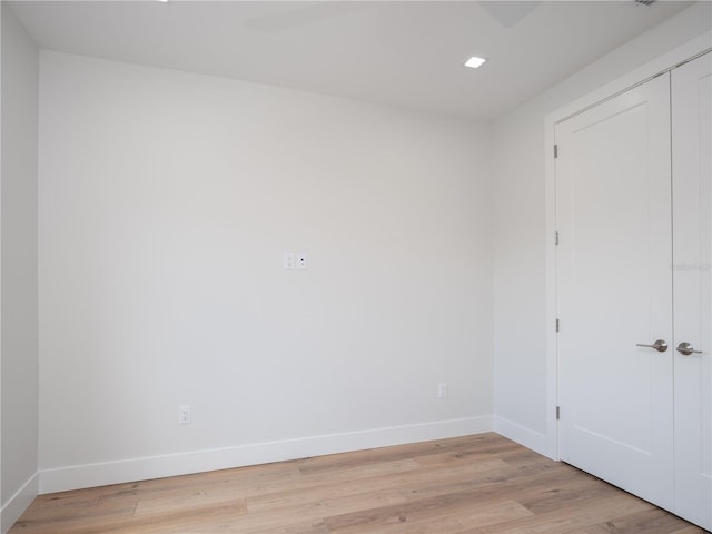 spare room with light hardwood / wood-style flooring