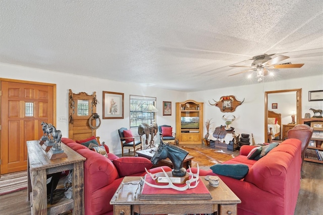 living room with hardwood / wood-style floors, a textured ceiling, and ceiling fan