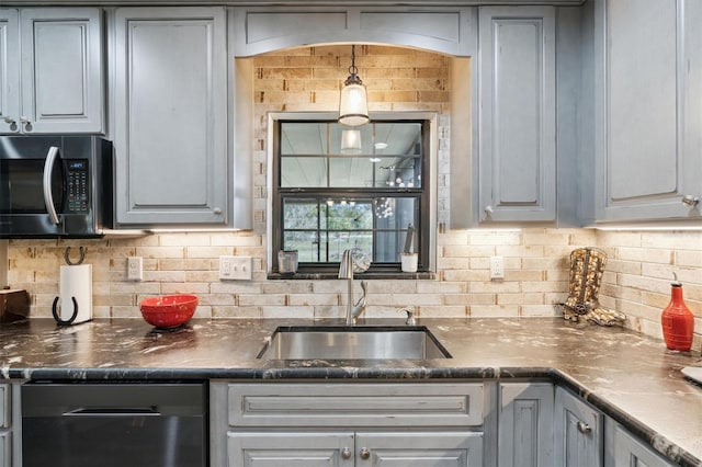 kitchen featuring gray cabinetry, decorative backsplash, sink, and stainless steel appliances