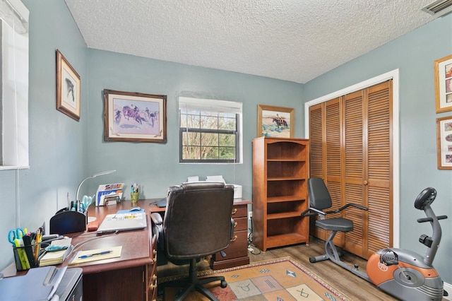 office space featuring a textured ceiling