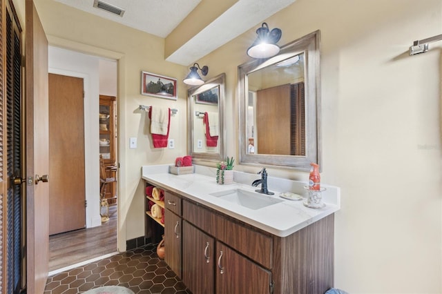 bathroom with vanity and tile patterned floors