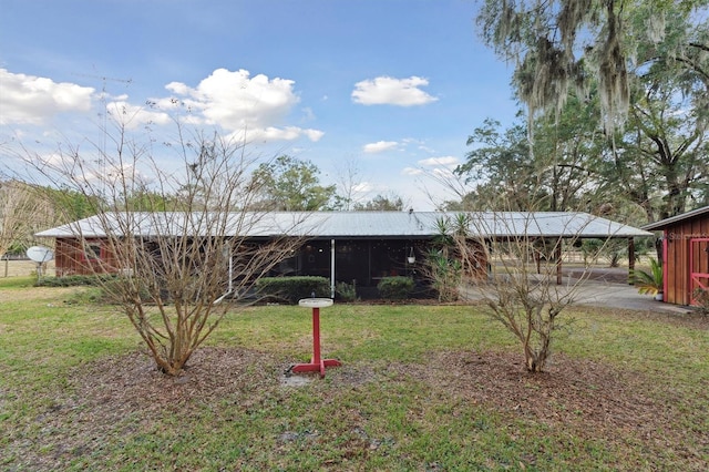 back of house with a yard