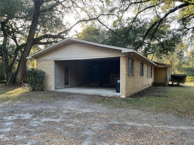 view of home's exterior featuring a carport