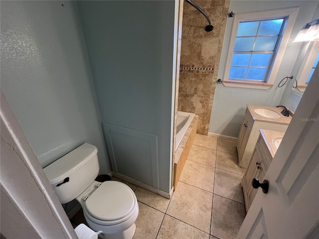 full bathroom with toilet, vanity, tile patterned floors, and tiled shower / bath