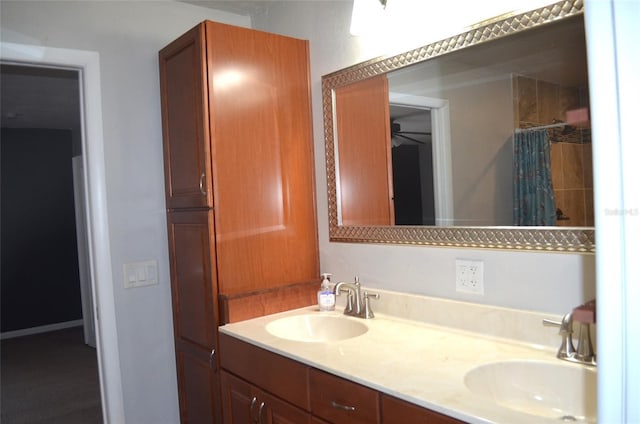 bathroom featuring a shower with curtain, vanity, and ceiling fan