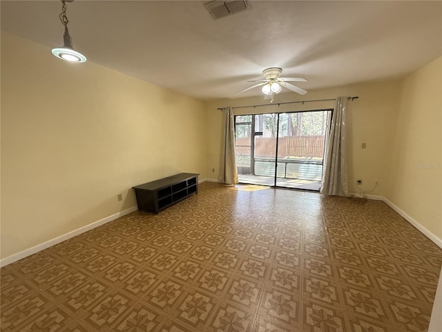 empty room featuring ceiling fan