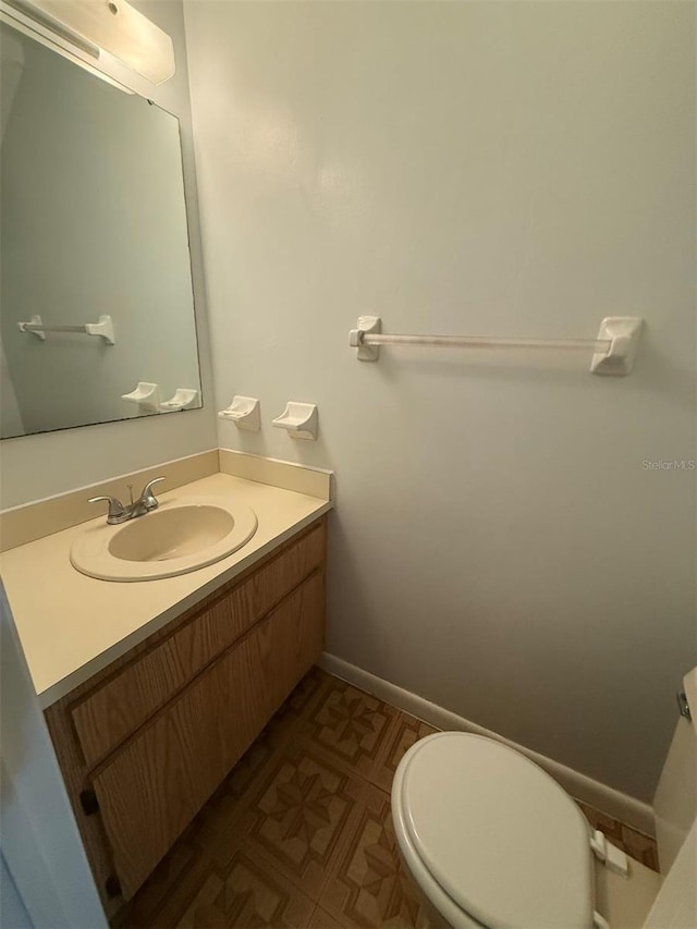 bathroom with vanity and toilet