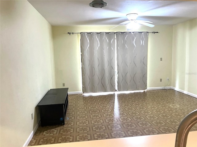 2635 SW 35th Pl Unit 1001, Gainesville, FL 32608 - empty room with a ceiling fan and baseboards