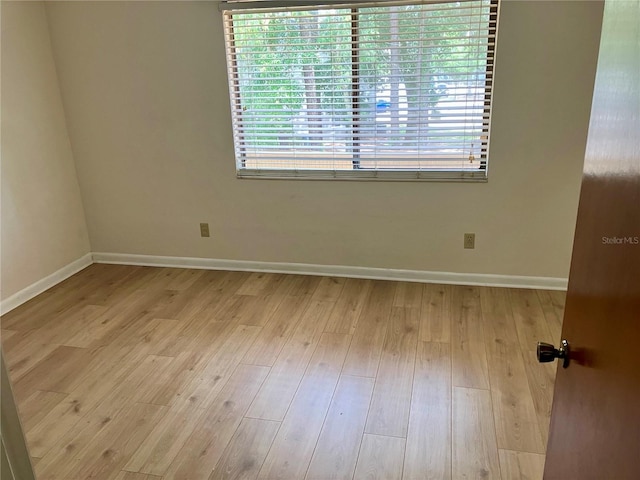 2635 SW 35th Pl Unit 1001, Gainesville, FL 32608 - spare room with baseboards and wood finished floors