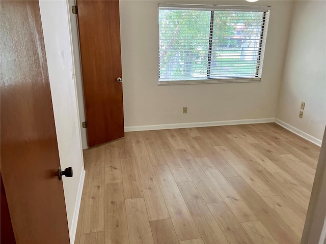 2635 SW 35th Pl Unit 1001, Gainesville, FL 32608 - empty room with light wood finished floors and baseboards