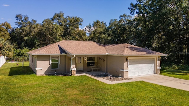 ranch-style home with covered porch, a garage, and a front lawn