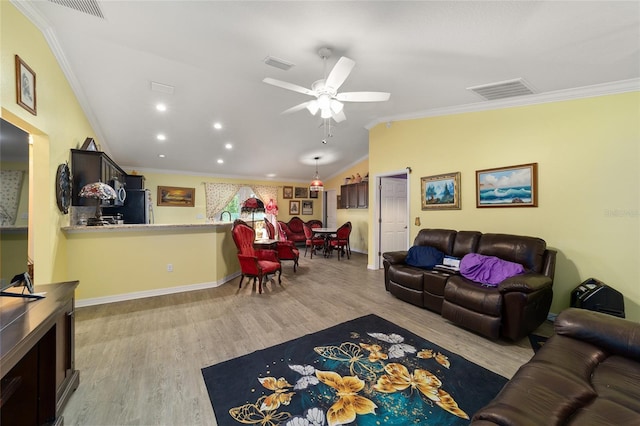 living room with ceiling fan, light hardwood / wood-style floors, and ornamental molding