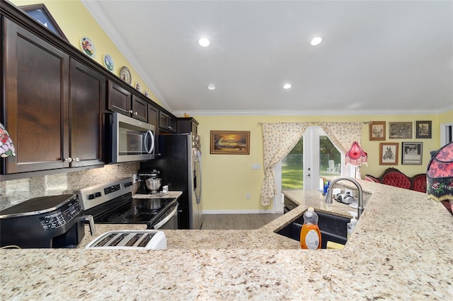 kitchen featuring crown molding, sink, light stone counters, and stainless steel appliances