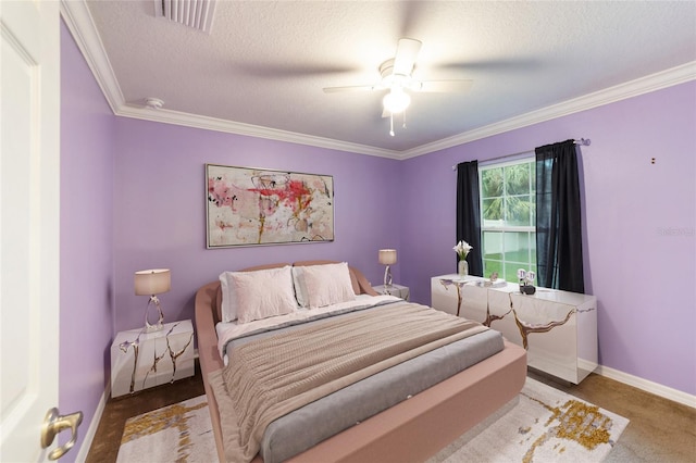 bedroom with a textured ceiling, ceiling fan, and crown molding