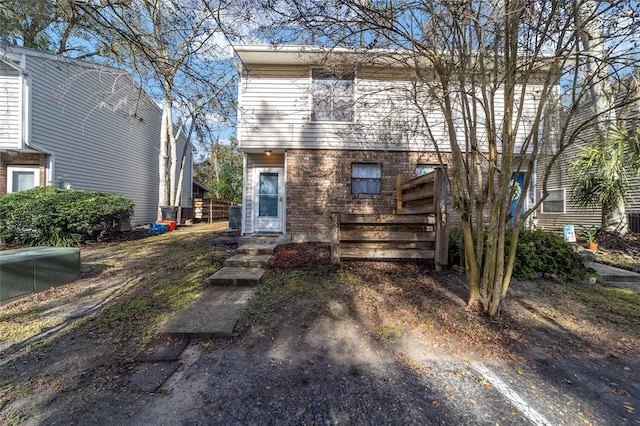 view of front of home with brick siding