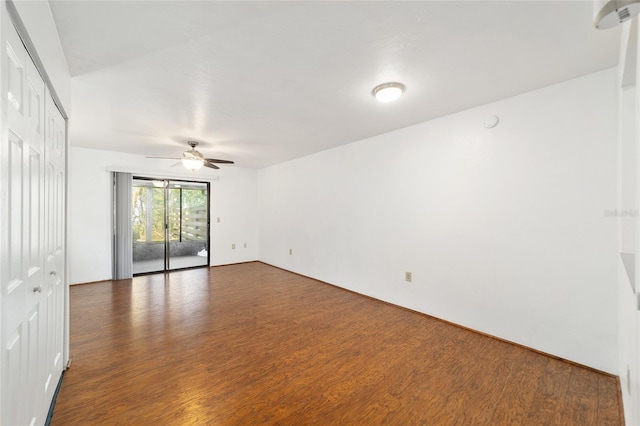 spare room featuring ceiling fan and wood finished floors