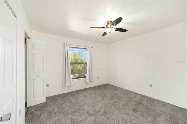 carpeted empty room with ceiling fan