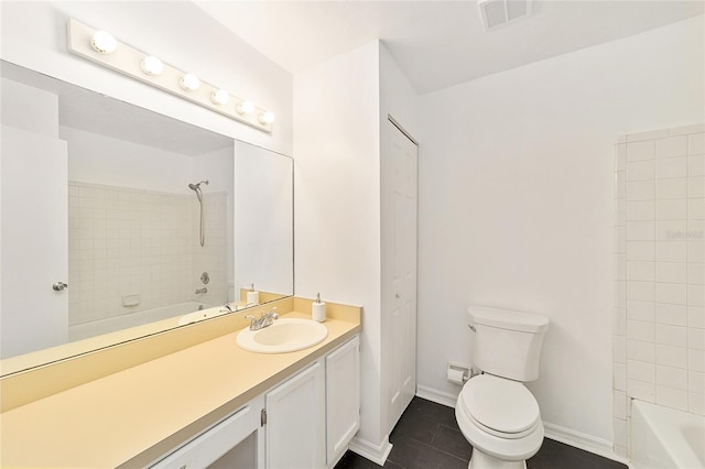 bathroom featuring baseboards, visible vents, toilet, and shower / tub combination