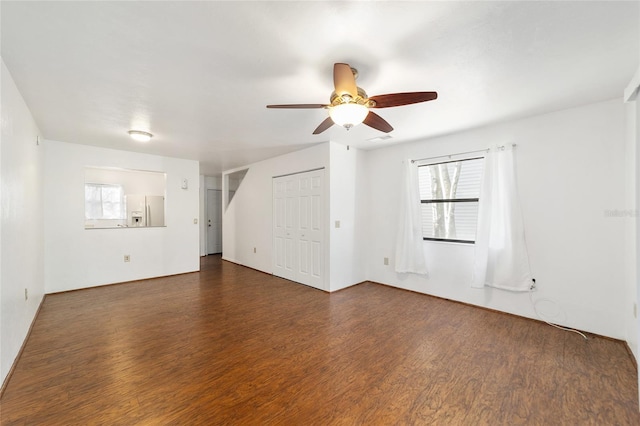 spare room featuring a ceiling fan and wood finished floors