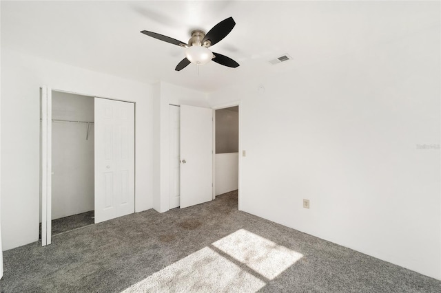 unfurnished bedroom with ceiling fan, carpet floors, and visible vents