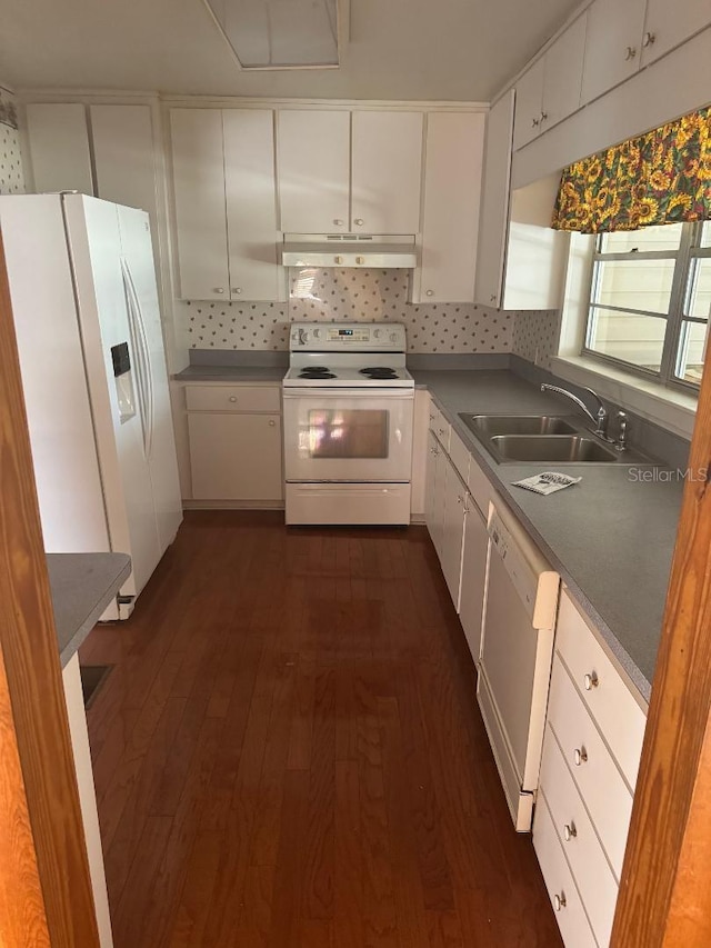 kitchen featuring white cabinets, dark hardwood / wood-style flooring, white appliances, and sink