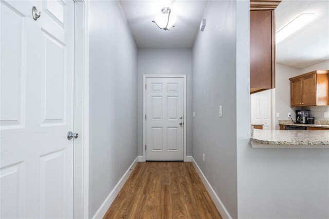 hall featuring wood-type flooring