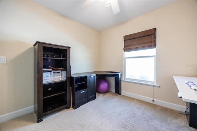 office space with light carpet and ceiling fan