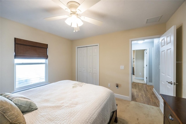 bedroom with ceiling fan and a closet