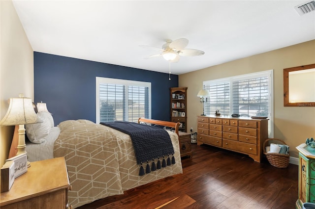 bedroom featuring ceiling fan and dark wood-type flooring