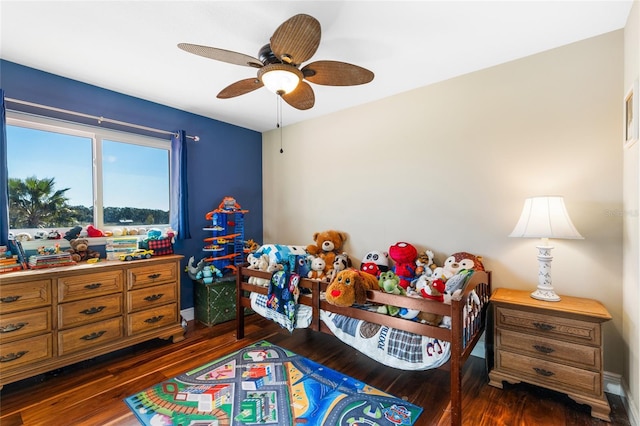 bedroom featuring ceiling fan and dark hardwood / wood-style floors