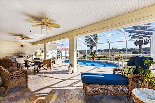 view of patio with glass enclosure and ceiling fan