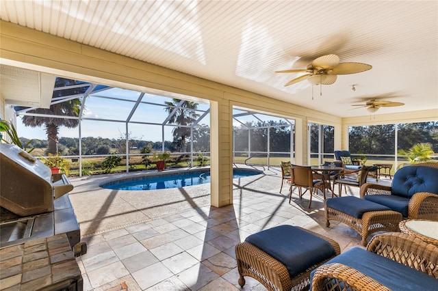 sunroom with a pool and ceiling fan