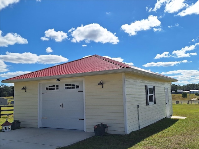 garage with a lawn