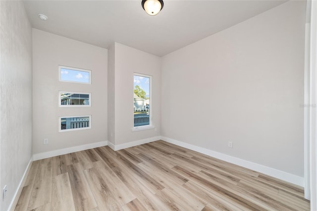 unfurnished room featuring light hardwood / wood-style floors